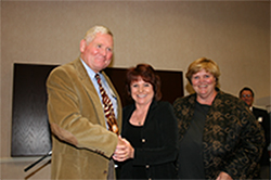 picture of a woman shaking hands with a man