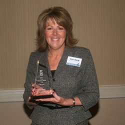 picture of a woman holding an award