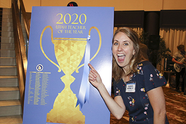 202 UTOY picture of a woman pointing to a sign