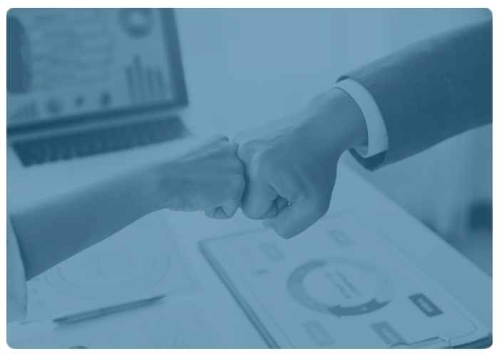 partners card two people bumping fists with computer and charts in the background