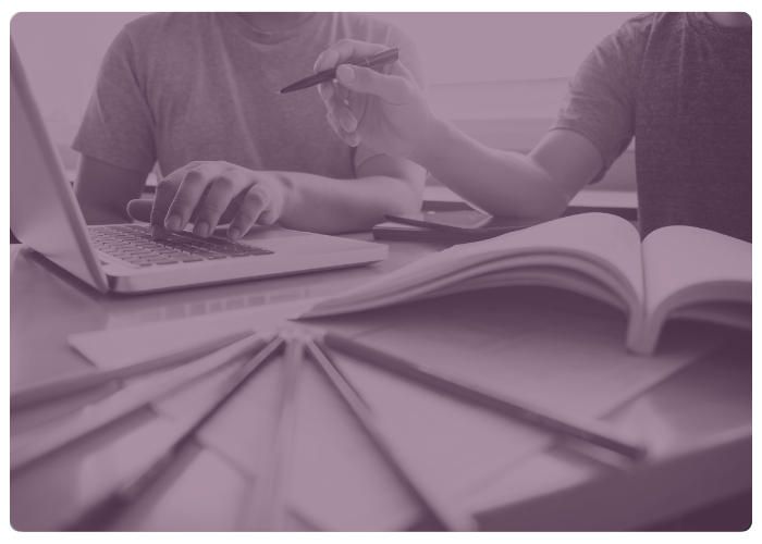 share card image of people working at a table with papers and computer