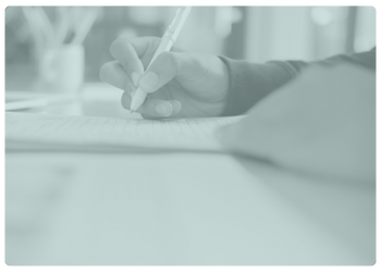 mint tinted image of an upclose hand signing a paper